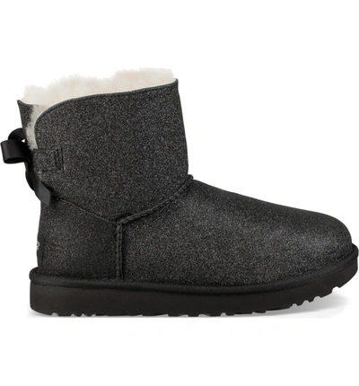 Shop Ugg Mini Bailey Bow Sparkle Genuine Shearling Boot In Black
