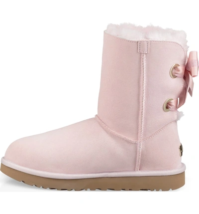 Shop Ugg Customizable Bailey Bow Genuine Shearling Bootie In Seashell Pink Suede