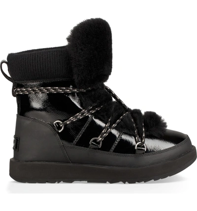 Shop Ugg Highland Genuine Shearling Waterproof Bootie In Black Leather