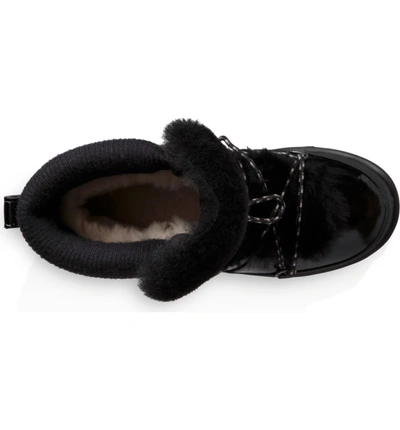 Shop Ugg Highland Genuine Shearling Waterproof Bootie In Black Leather