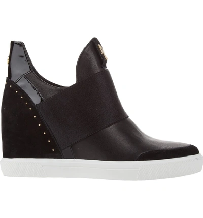 Shop Donna Karan Cailin Studded Wedge Sneaker In Black Leather