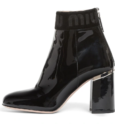 Shop Miu Miu Logo Patent Bootie In Black Patent