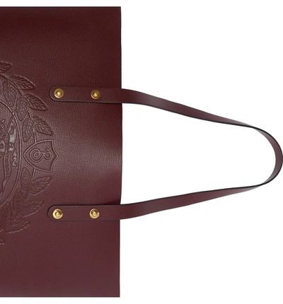 Shop Burberry Embossed Crest Small Leather Tote In Burgundy