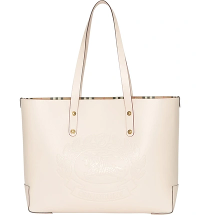 Shop Burberry Embossed Crest Small Leather Tote In Limestone