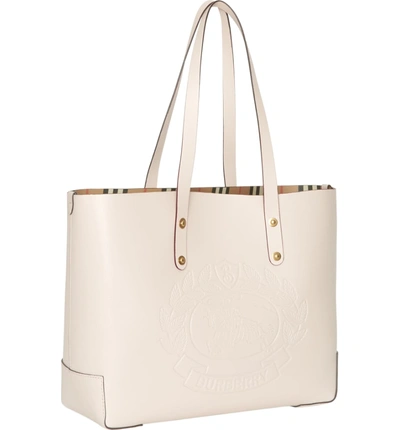 Shop Burberry Embossed Crest Small Leather Tote In Limestone
