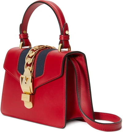 Shop Gucci Mini Sylvie Top Handle Leather Shoulder Bag - Red In Hibiscus Red/brb