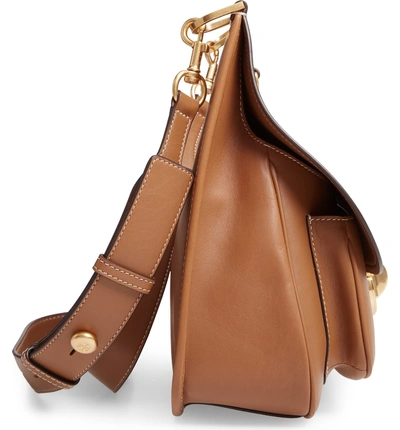 Shop Tory Burch James Leather Saddle Bag - Brown In Moose