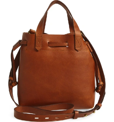 Shop Madewell The Mini Pocket Transport Leather Drawstring Tote In English Saddle