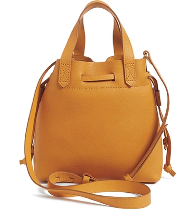Shop Madewell The Mini Pocket Transport Leather Drawstring Tote In English Saddle