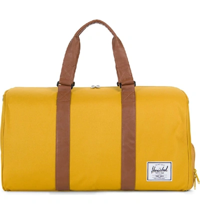 Shop Herschel Supply Co Novel Duffle Bag - Yellow In Arrow Wood/ Tan Leather