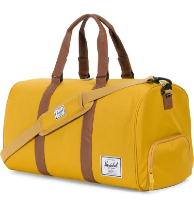 Shop Herschel Supply Co Novel Duffle Bag - Yellow In Arrow Wood/ Tan Leather