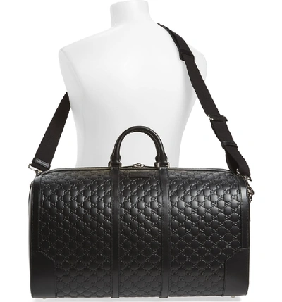 Shop Gucci Signature Strap Leather Duffel - Black