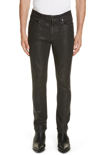 Shop Saint Laurent Wax Coated Skinny Jeans In Black