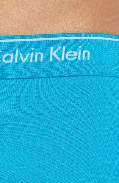 Shop Calvin Klein 4-pack Cotton Briefs In Mistreal/ Sea/ Windy