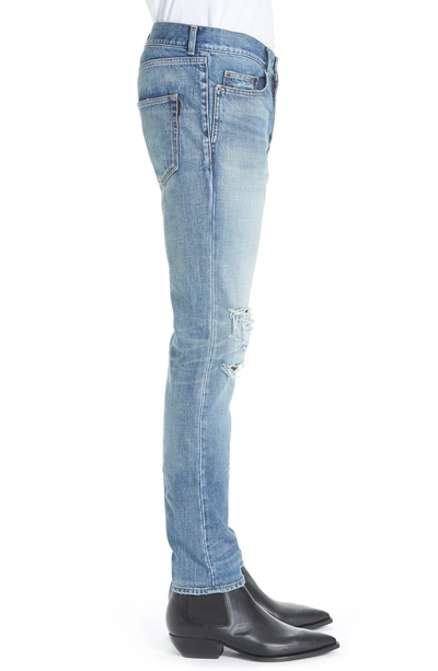 Shop Saint Laurent Destroyed Light Skinny Fit Jeans In Blue