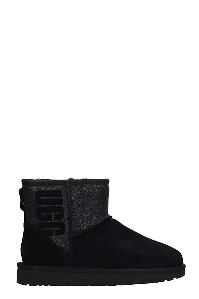 Shop Ugg Classic Mini Boots In Black Shearling