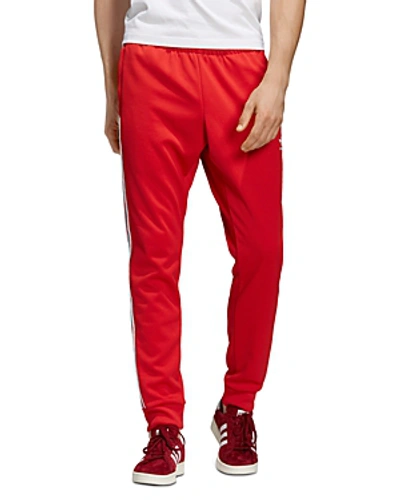 Shop Adidas Originals Superstar Track Pants In Red