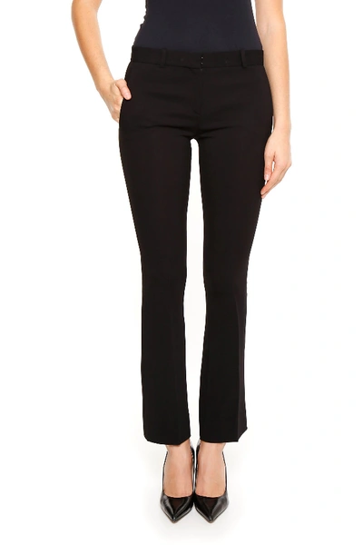 Shop Versace Flared Cady Trousers In Black