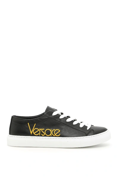 Shop Versace Embroidered Logo Sneakers In Black