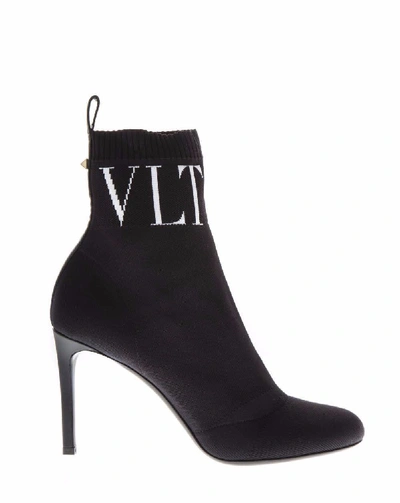 Shop Valentino Garavani Vltn Ankle Sock Boot In Black
