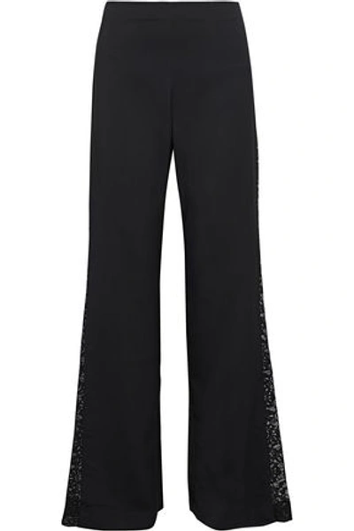 Shop Alice And Olivia Mandy Lace-paneled Woven Flared Pants In Black