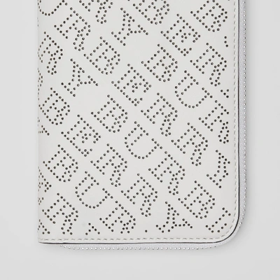 Shop Burberry Perforated Leather Ziparound Wallet In White