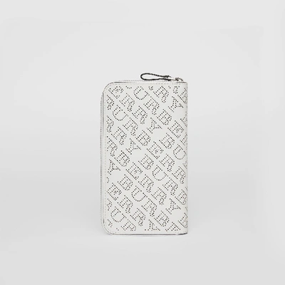 Shop Burberry Perforated Leather Ziparound Wallet In White