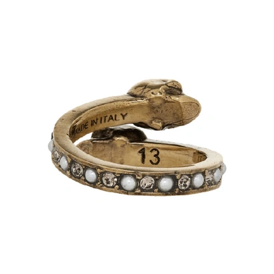 Shop Alexander Mcqueen Gold Twin Skull Ring In 7124 0448