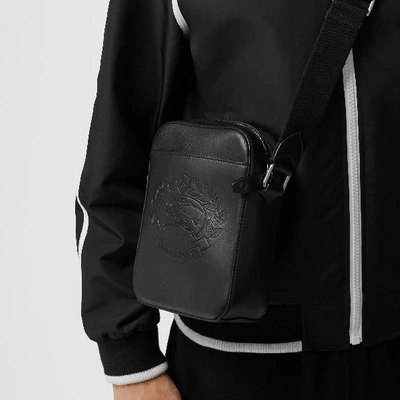 Shop Burberry Small Embossed Crest Leather Crossbody Bag In Black