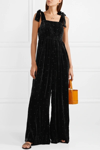 Shop Ulla Johnson Minnet Bow-embellished Swiss-dot Velvet Jumpsuit In Black