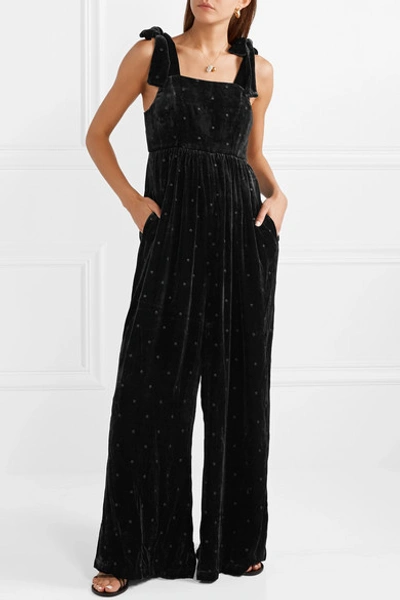 Shop Ulla Johnson Minnet Bow-embellished Swiss-dot Velvet Jumpsuit In Black