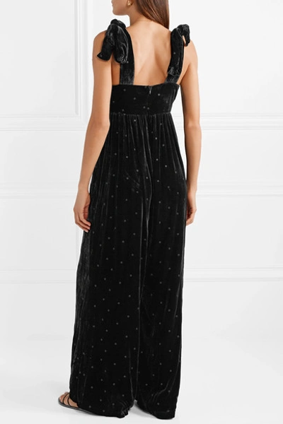 Shop Ulla Johnson Minnet Bow-embellished Swiss-dot Velvet Jumpsuit In Black