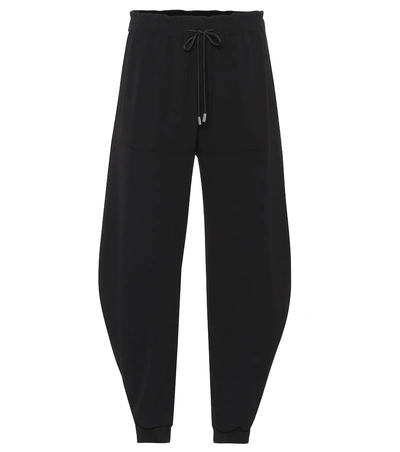 Shop Chloé High-rise Tapered Crêpe Pants In Black