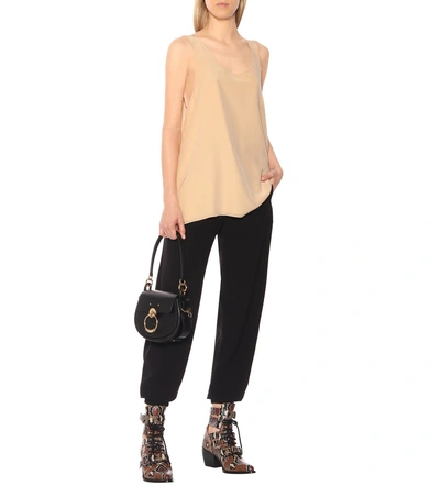 Shop Chloé High-rise Tapered Crêpe Pants In Black