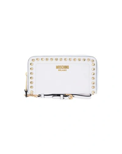 Shop Moschino Wallets In White