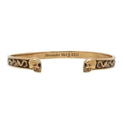 Shop Alexander Mcqueen Gold Twin Skull Bracelet In 0448 Gold