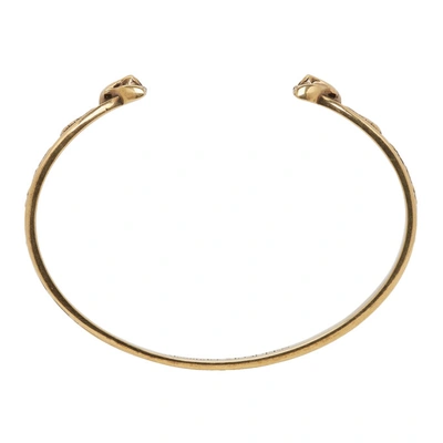 Shop Alexander Mcqueen Gold Twin Skull Bracelet In 0448 Gold