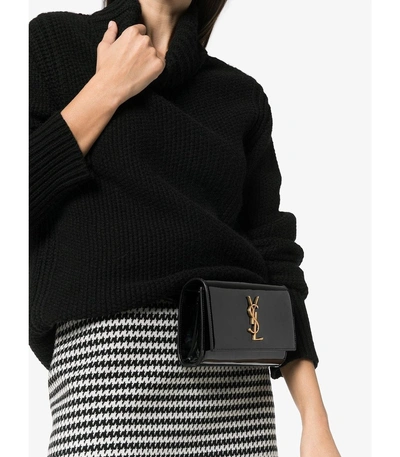 Shop Saint Laurent Kate Patent Leather Belt Bag In Black