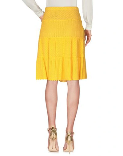 Shop Moschino Knee Length Skirts In Yellow