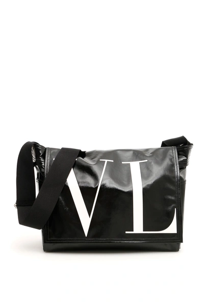 Shop Valentino Vltn Messenger Bag In Nero Bianco (black)