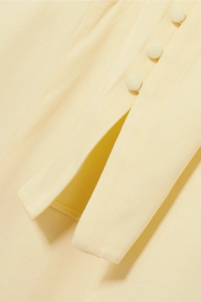 Shop Les Hã©roã¯nes The Tina Wrap-effect Satin Jumpsuit In Pastel Yellow