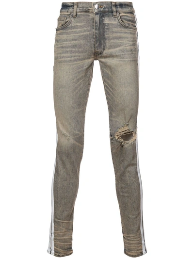 Shop Amiri Faded Distressed Jeans - Neutrals
