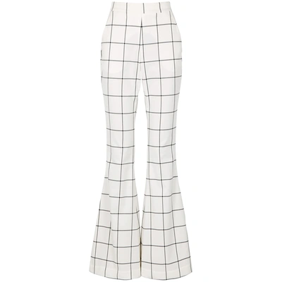 Shop Rebecca Vallance Pierre Flared Checked Trousers In White And Black