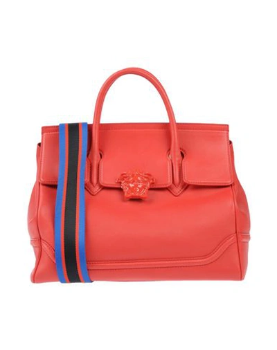 Shop Versace Handbag In Red