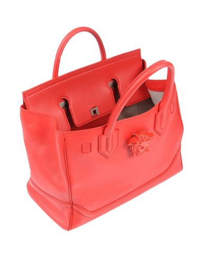 Shop Versace Handbag In Red