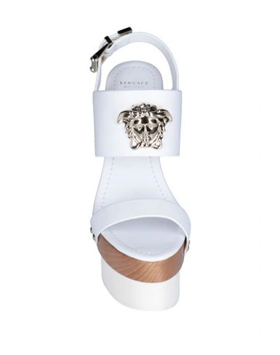 Shop Versace Sandals In White