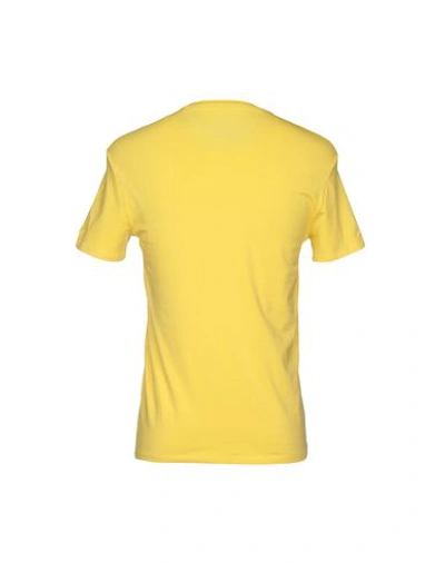 Shop Guess T-shirts In Yellow