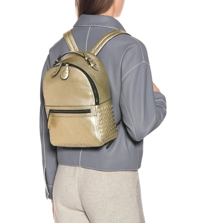Shop Bottega Veneta Electre Metallic Leather Backpack In Gold