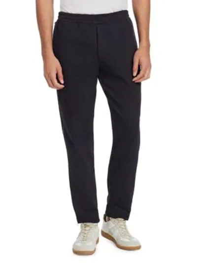 Shop Alexander Mcqueen Zip Jogger Pants In Black