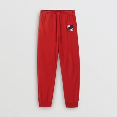 Shop Burberry Chequer Ekd Cotton Trackpants In Military Red